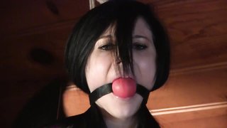 Raven-haired chick in pink lingerie is enjoying bondage