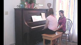 Sexy music teacher abuses her student during the lesson