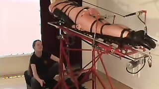 Nice gagged hottie is getting suspended with leather belts