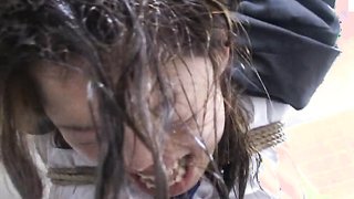 Gagged chick gets her mouth fucked in the Japanese toilet