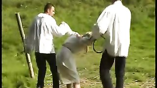 Nasty and painful outdoor spanking with a submissive blonde