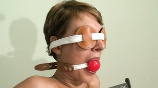 Blindfolded and chained babe with gag in mouth and bounded legs
