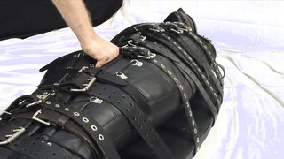 Black leather mummification, she must feel bad in there