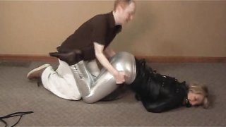 Young slut puts on a straitjacket and shows sexy legs