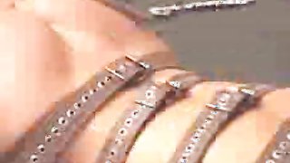 Awesome belted beauty with big boobs gets penetrated with needles