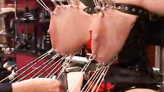 Gorgeous lady with massive boobies is enjoying torturing