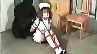 Sexy office hottie in white straitjacket enjoys femdom