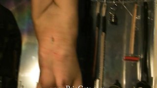 Awesome hottie hangs upside down in the dark room of pain