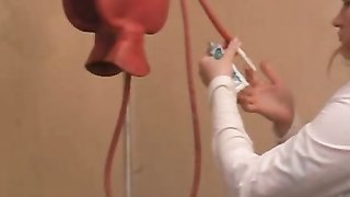 Hot lady prepares her passionate doll for dirty anal games