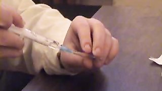 Amazing young nurse puts injections in a perfect round bottom