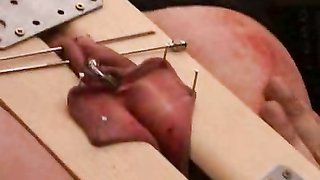 Hottie with impaled tits is definitely enjoying extreme pain