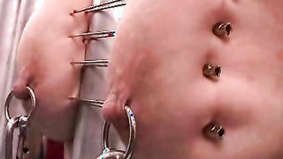 Beautiful blonde with impaled boobies feels insane pain