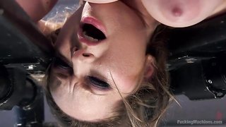 Automatic dildo toy drills a big-boobed brunette