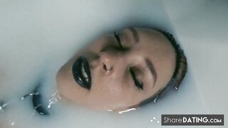 Tattooed BDSM Babe in Latex and Milk Bath
