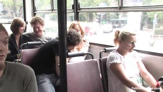 Slave with a ball gag and her master waiting for a bus