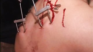 Submissive Asian slave impaled with needles