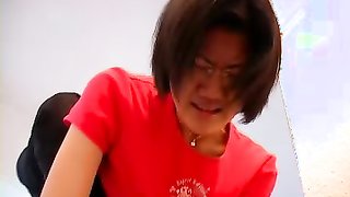 Asian lass wearing glasses takes her pants off and shows her bush then spanked