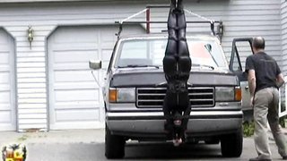This maniac tied up a slut to his truck's front and moves her everywhere