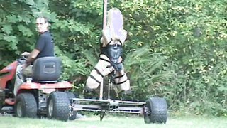 Lovely teen is completely bound on a moving machine fuck cart