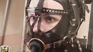 Awesome beauty with angelic look and leather mask is trying oxygen starvation