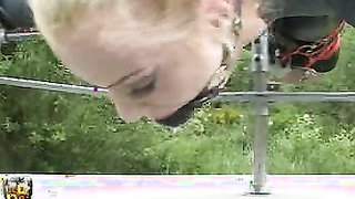 Very uncomfortable pose for a submissive gagged blonde