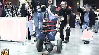 Beauty in blue latex and red belts is trying public humiliation