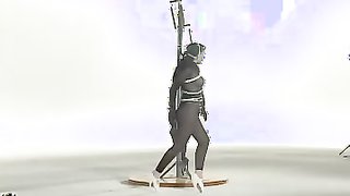 Two puppet latex dolls are walking while being bounded