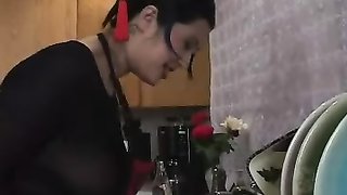 Master hangs his submissive doll upside down and wraps her body