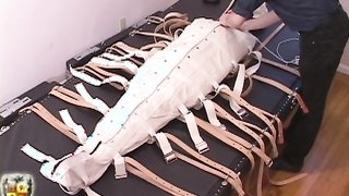 Fully body strait-suit  and mask holds the slave tight