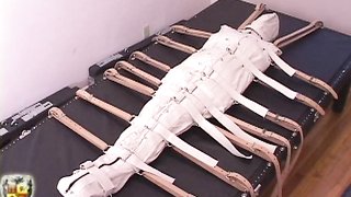 Mummification of a slave and total restraint with belts