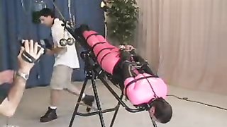 Curvy slut in tight costume suffers on centrifuge bench