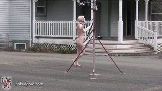 Naked slut is forced to walk in circles outdoors