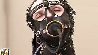 Masked whore in nylon suit machine fucked while sitting
