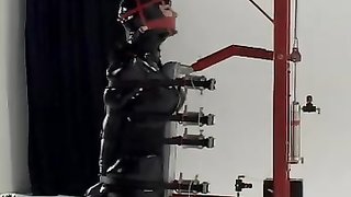 Beautiful teen is bound completely in full latex costume